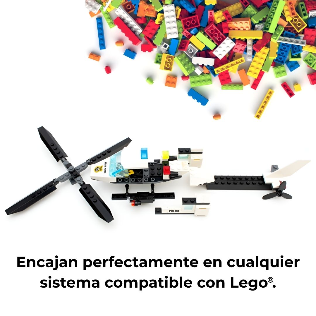Helicóptero de bloques de construcción desmontado sobre mesa, rodeado de piezas tipo Lego compatibles