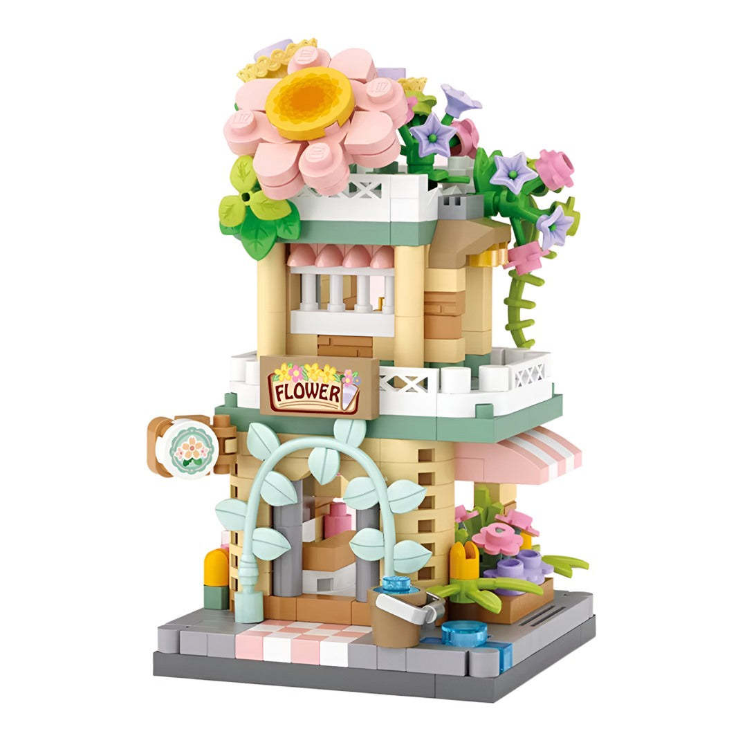 Tienda de Flores en miniatura armada con bloques sobre fondo blanco