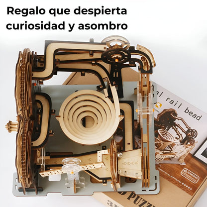 Kit puzzle 3D madera con canicas sobre su caja — regalo original para amantes de los rompecabezas y proyectos DIY.